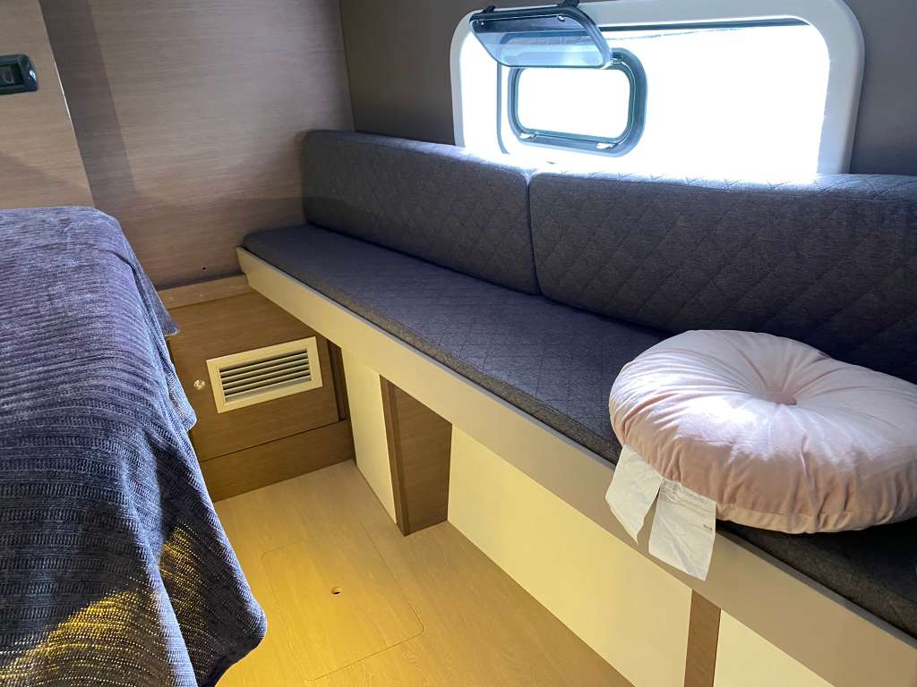 Bali Catspace cabin seating area with bench, window, and storage